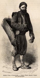 Een waterdrager, rondtrekkende handelaar poserend met zijn uitrusting, een soort tankdoos en een container gebruikt als maat en beker, in Roestchouk (Roemenië), gravure naar de tekening van Emile Bayard, illustrerend de reis naar Bulgarije, door Guillaume  door Emile Antoine Bayard