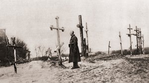 Een Russische soldaat bij het graf van een wapenbroeder tijdens de Eerste Wereldoorlog, uit The Illustrated War News, 1915