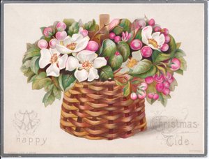 Een Victoriaanse kerstkaart van bloemen en bladeren in een rieten mand, ca. 1880