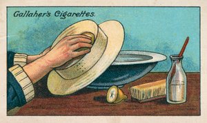 Een witte strooien hoed schoonmaken (chromolitho) door English School
