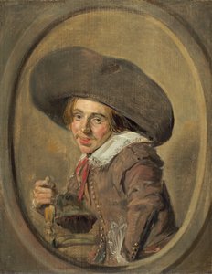 Een jonge man met een grote hoed