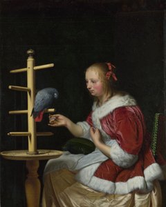 Een vrouw in een rood jasje die een papegaai voedt