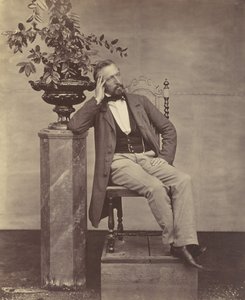 [Mathias Höusermann zittend met elleboog op voetstuk met een vaas bloemen], 1850s-60s door Franz Antoine