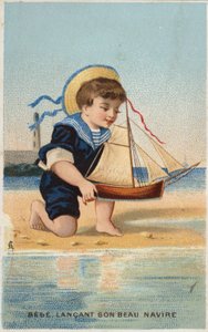 Jongen speelt met speelgoedzeilboot