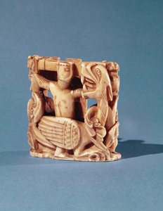 Schaakstuk in de vorm van een ridder die tegen een draak vecht