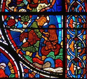Detail (God creëert de mens uit klei) uit een raam van de gelijkenis van de Barmhartige Samaritaan