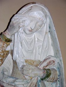 De graflegging, detail van een vrouwelijke heilige