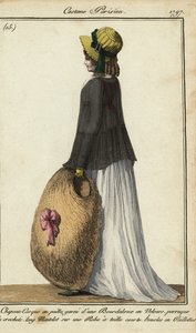 Vrouw met strohoed en zwarte mantel