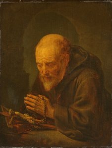 Een kluizenaar in gebed door Gerrit Dou