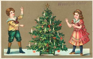 Meisje en jongen met kerstboom