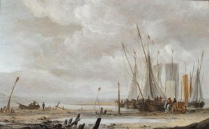 Een strandtafereel met opgestelde vissersboten