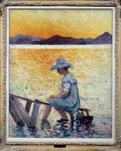 Saint Tropez, zonsondergang Een vrouw die met haar voeten in het water aan de kust zit door Henri Charles Manguin