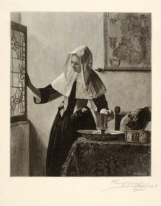 Jonge vrouw bij een raam