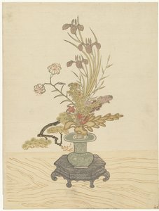 Ikebana bloemstuk in groene vaas