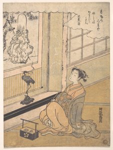 Een jonge vrouw zit in een kamer en kijkt naar een kakemono van Fukurokujin door Isoda Koryusai