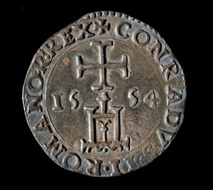 Munt van de Republiek Genua: zilveren teston (of testone) van de Zegen. Voorzijde met de poort van Genua onder een kruis. 1554. Genua, Musei di Strada Nuova