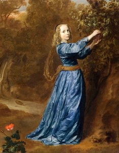 Portret van een meisje die druiven plukt
