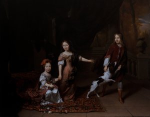 Kinderen spelen met een hond in een woonkamer