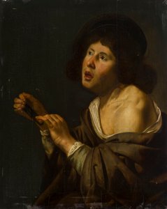 Portret van een jongen met een instrument