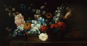 Pioenen, chrysanten en andere bloemen in een mand