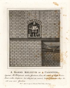 Bas-reliëf van een tuinman op de muur van Mr