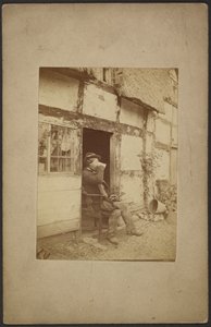 [Zittende man drinkt uit mok in open deuropening]. door John Whistler