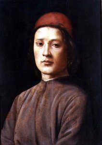 Portret van een jonge man met een rode pet