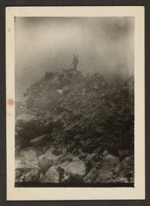 [Man Atop Rock Pile]