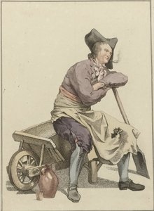 Man zittend op de rand van een kruiwagen