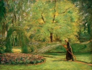Het ronddeel in de haagtuin met bloemenbesproeier