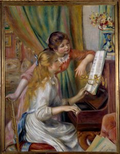 Jonge meisjes aan de piano
