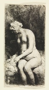 Vrouw die haar voeten baadt in een beek door Rembrandt van Rijn