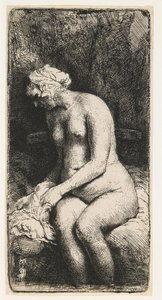 Vrouw die haar voeten baadt in een beek door Rembrandt van Rijn