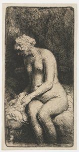 Vrouw die haar voeten baadt in een beek door Rembrandt van Rijn