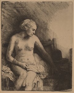 Vrouw in bad met een hoed naast zich door Rembrandt van Rijn