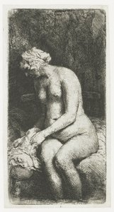 Vrouw die haar voeten baadt in een beek door Rembrandt van Rijn
