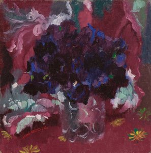 Blauwe viooltjes in een glas