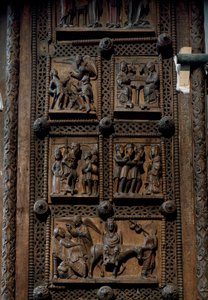 Romaans kunst: houten deur uit het midden van de 12e eeuw van de Kerk van St. Maria van het Kapitool in Keulen, Duitsland (Sankt Maria im Kapitol, Keulen). Scènes die de aankondiging aan de herders, de geboorte, de aanbidding van de wijzen en de