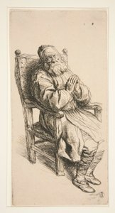 Oude man slapend in een fauteuil