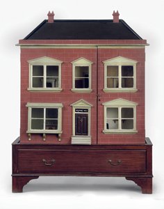 Poppenhuis op bijbehorende basis met lade