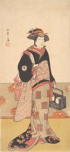 De acteur Iwai Hanshiro IV als een vrouw in een zwarte kimono, ca. 1780