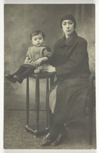 Untitled Postcard (Woman with Boy on Stand) door Unknown
