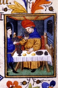 Voorstelling van de maand januari. Een dienaar zet eten op de tafel van zijn meester. Miniatuur van een 14e eeuws manuscript