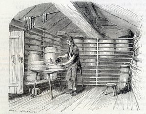 Gruyère kaaswinkel in een Zwitsers chalet (het wassen van de korst) - in 