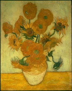 Veertien zonnebloemen in een vaas