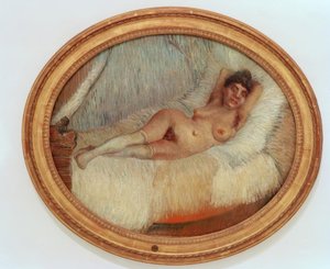 Vrouwelijk naakt op een bed