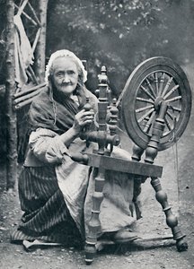 Een oude Ierse vrouw bij haar spinnewiel, 1912 door W. Lawrence