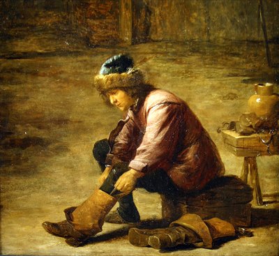 Een jonge man die een laars aantrekt door David Teniers the Younger