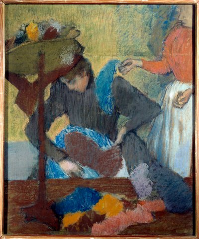 Bij de modiste door Edgar Degas