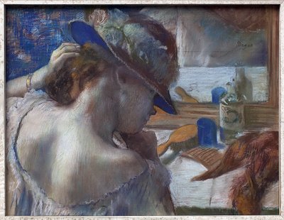 Voor de spiegel door Edgar Degas